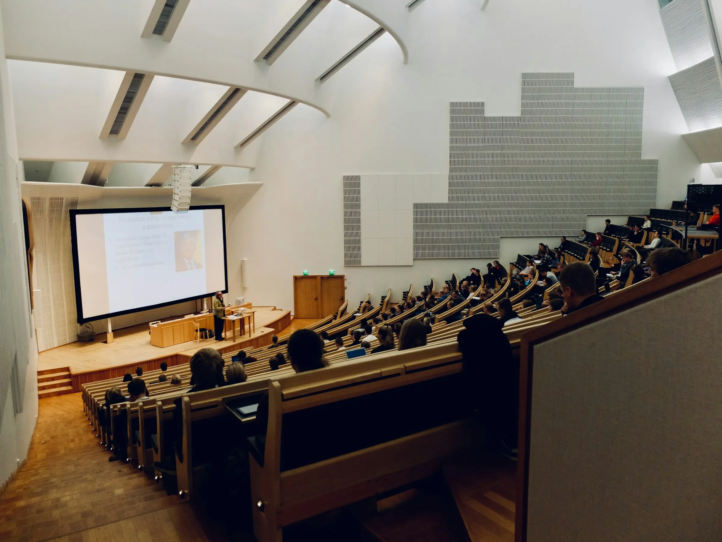 Inside a university classroom from the top back